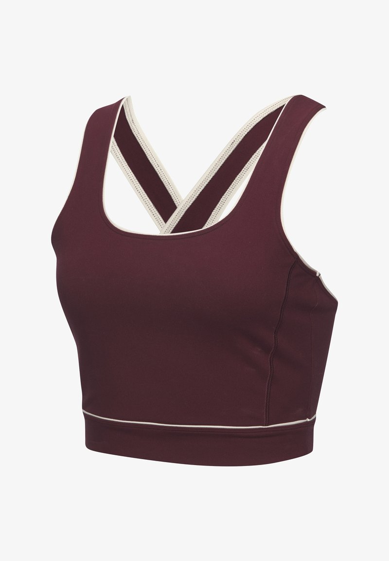 Bordo sporta krekls ar izgriezumu, kuram ir krustotas lences un baltas apmales. Izgatavots no elastīgas, gludas auduma, kas nodrošina komfortu.