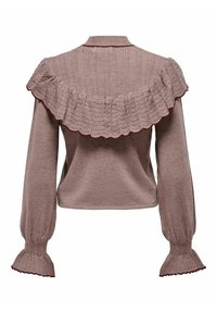 Pull tricoté en rose poudré avec un col à volants, de longues manches bouffantes et des poignets texturés. Il présente une coupe ajustée avec une texture douce.