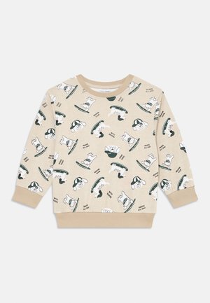 Beige Sweatshirt mit einem verspielten Print von Hunden auf Skateboards. Langarm, runder Ausschnitt, mit gerippten Bündchen und Saum.