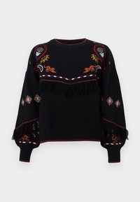 Μαύρος σ sweater με πολύχρωμα κεντήματα που εμφανίζουν ανθηρούς και ζωϊκούς σχεδιασμούς. Ολοκληρωμένο με λεπτομέρεια φ fringe στο μέσο και σχέδια στους μανικιών.