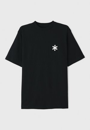 Black cotton t-shirt with short sleeves, round neck, and white asterisk logo on the left chest. Smooth texture, casual design.