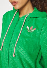adidas Originals Tröja med dragkedja - green