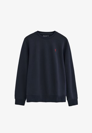 Navy blue crewneck sweatshirt with ribbed cuffs and hem, featuring a small red embroidered logo on the left chest.