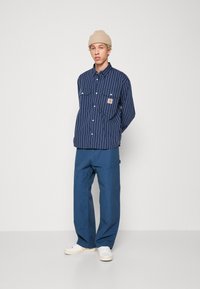 Carhartt WIP WIDE PANEL PANT - Stolarske traperice - blue-grey