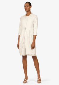 White tailored coat with a smooth texture, featuring three-quarter sleeves, a hook-and-eye closure, and a knee-length cut.