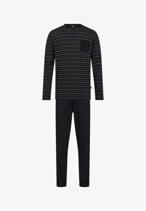 Stripet langærmet top i sort, grå og creme med en brystlomme, parret med ensfarvede sorte bukser. Blødt stof, afslappet pasform.