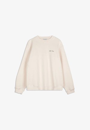 Cream-colored long-sleeve sweatshirt with ribbed cuffs and hem, featuring small "Bobo Choses" text on the left chest area.