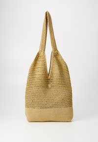 Sac fourré en paille de couleur beige clair, offrant un design spacieux à ouverture supérieure avec deux anses en boucle et une base solide. Surface texturée avec une finition lisse.