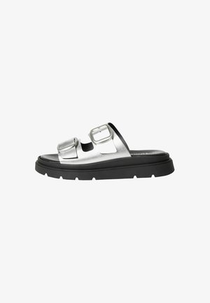 Silver metallic slide sandal with two adjustable buckles, black thick sole, and a smooth texture. Minimalist design with open-toe feature.