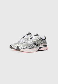 Sport shoes featuring a mesh upper in silver and black, with pink accents. The design includes a thick sole and a structured, streamlined shape.