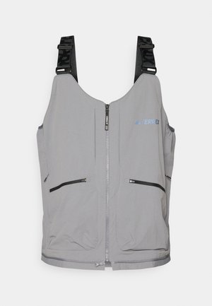 Gray vest with zipper closure and adjustable straps. Features two front zip pockets and subtle logo accents. Smooth texture, lightweight design.