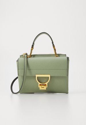 Green leather handbag with a structured design, gold hardware, and a top handle. It features a fold-over flap and an adjustable strap.