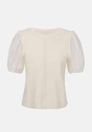 Blouse crème à manches courtes avec une texture côtelée et des manches bouffantes en chiffon, dotée d'un col rond et d'un détail de tricot vertical au centre.
