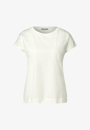 Biała bawełniana koszulka z krótkim rękawem, ozdobiona błyszczącymi srebrnymi ćwiekami na ramionach i okrągłym dekoltem. Gładka faktura.