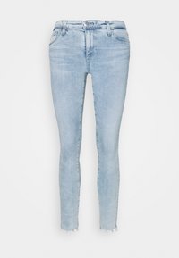 Světle modré skinny džínové kalhoty s roztrhaným lemem, pětikloubkovým designem a klasickým zipem s knoflíkovým uzávěrem.