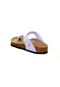 Purple footbed sandal with cork sole, adjustable strap, and textured black rubber outsole. Features a buckle for secure fit.