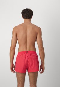 BOSS MOONEYE - Plaukimo šortai - medium red