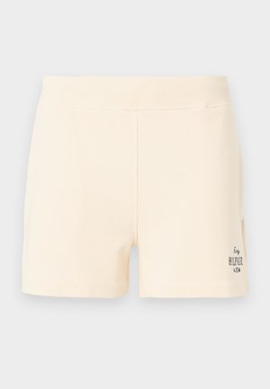 Lichtcrème katoenen shorts met een zachte textuur, voorzien van een logo-detail op de rechteronderzijde; een eenvoudig, aansluitend ontwerp met een tailleband.