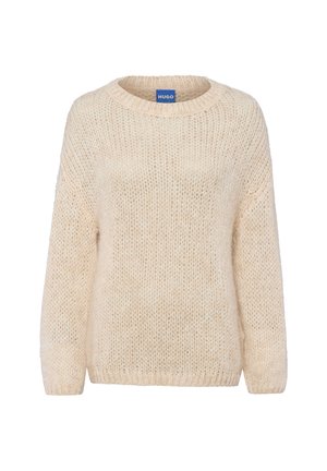 Pull en tricot beige avec un col rond, des manches longues et une coupe ample. Fabriqué en tissu doux et texturé, présentant un subtil tissage ouvert.