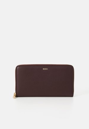Dark burgundy leather wallet with a smooth texture, zip closure, and gold "BOSS" logo at the front. Simple rectangular design.