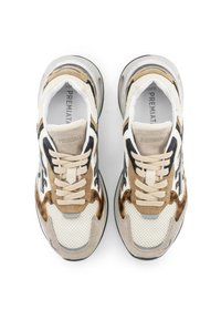 Sneakers with a mesh upper in cream, brown suede accents, and black details. Features a padded collar and flat laces. Rubber sole.