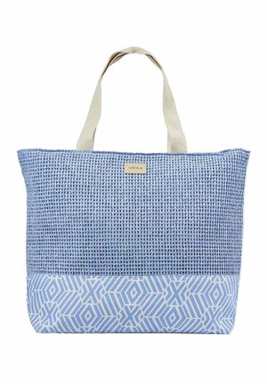 Sac fourre-tout bleu clair avec moitié supérieure tissée, moitié inférieure à motifs géométriques et anses en tissu blanc cassé.
