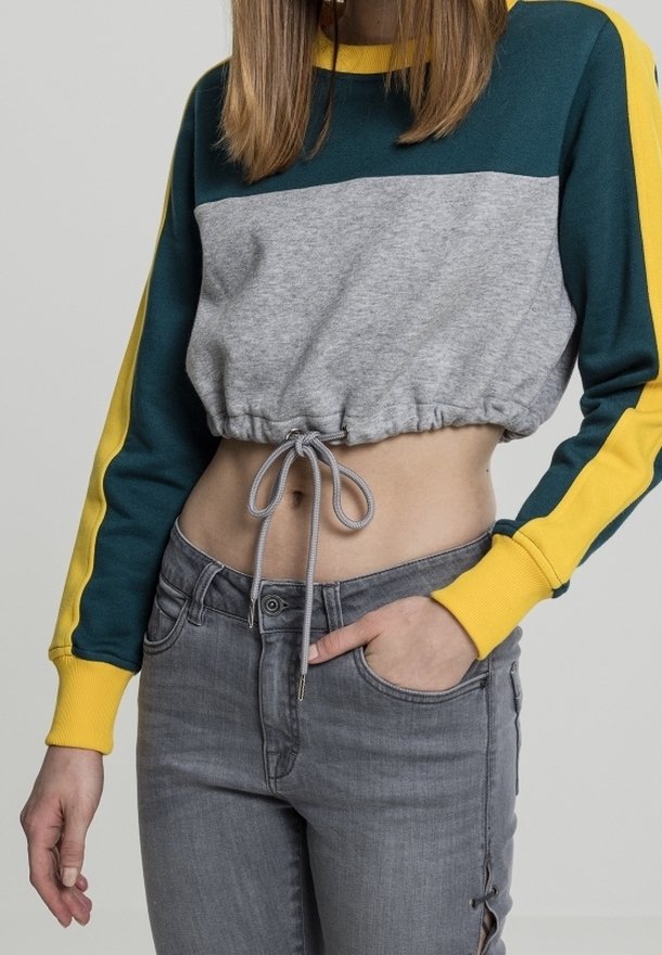 Sudadera recortada con un cuerpo gris, mangas teal y acentos amarillos. Cuenta con un dobladillo ajustable y un corte relajado.