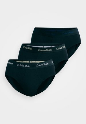 Tres pares de calzoncillos negros de Calvin Klein con una cinturilla elástica suave que presenta el nombre de la marca, textura lisa y un diseño de corte clásico.