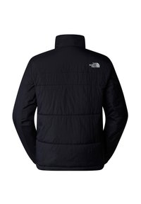 Chaqueta acolchada negra con collar alto, patrón de acolchado horizontal y un logo reflectante en la parte superior de la espalda. Tejido suave y ligero.