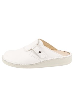 White slip-on leather clog with adjustable strap and cushioned insole, designed for comfort and easy wear.