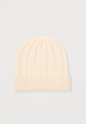 Cream-colored knitted beanie with cable knit pattern and folded ribbed cuff, displayed on a plain light background.
