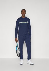 Lacoste Sport TENNIS PANT - Spodnji deli trenirk - navy blue