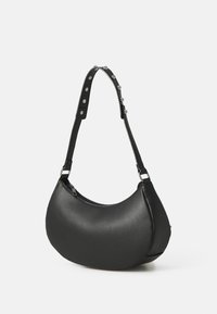 Black hobo bag made of smooth leather. Features a rounded silhouette, zip closure, and an adjustable strap with silver hardware accents.