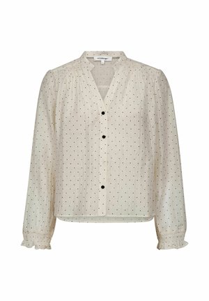 Bluză bej deschis cu decolteu în V, mâneci lungi, închidere cu nasturi negri și buline negre mici pe toată suprafața; manșete cu volane.