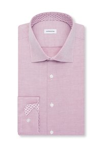Chemise rose à manches longues pliée avec un petit motif texturé, boutons blancs et motif floral à l'intérieur du col et des poignets, étiquetée « seidensticker ».