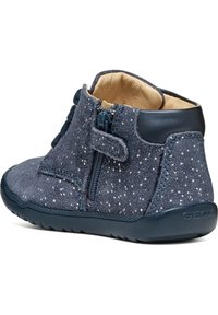 Navy blue suede ankle boots with white speckles, side zipper, and hook-and-loop strap. Features a textured rubber sole and leather lining.
