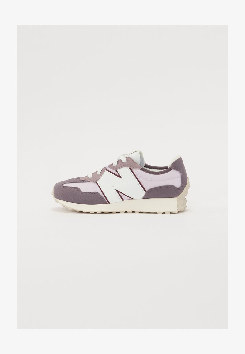 Light purple sneakers with a textured fabric upper, white accents, and a sturdy rubber sole. Features a prominent "N" logo on the side.