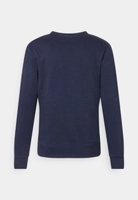 Felpa blu navy con maniche lunghe, scollo rotondo e polsini a costine. Realizzata in tessuto morbido con una texture liscia e design minimal.