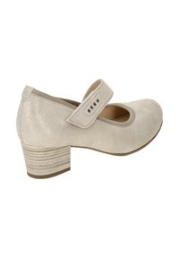 Beige suede Mary Jane shoe with a round toe, adjustable strap, and a textured block heel featuring horizontal stripes.