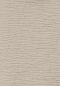 Tissu beige clair avec une texture côtelée subtile horizontale et verticale créant un motif matelassé doux.