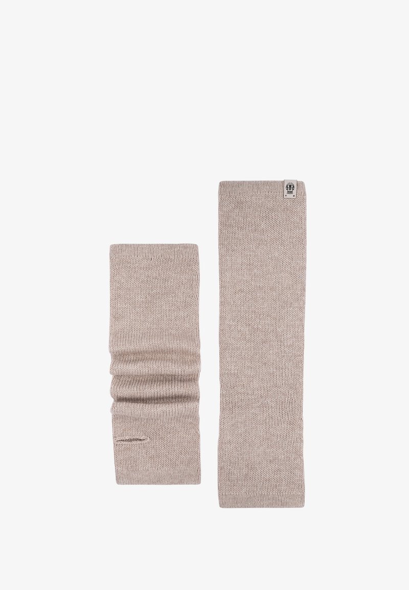 Pair of beige knitted arm warmers, one stretched flat and the other scrunched with thumb hole visible.