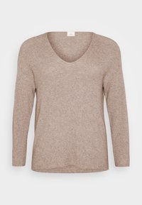 Light brown, ribbed sweater with long sleeves and a V-neckline. Smooth texture with a relaxed fit and a straight hem. No visible patterns or accents.