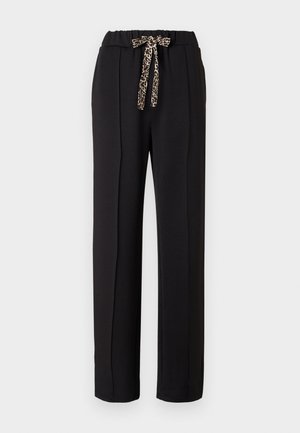 Black, loose-fitting pants with an elastic waist, featuring a leopard print drawstring. Smooth fabric with side pleats for structure.