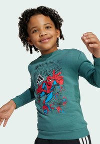 Felpa turchese in cotone con scollatura a girocollo. Presenta una grande grafica colorata di Spider-Man stampata sul davanti.