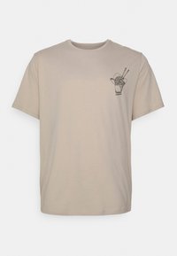 Beige cotton t-shirt featuring a small black graphic of a takeout container with noodles and chopsticks on the left chest area.