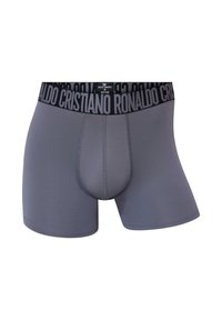 Grå bokserbriefs med et sort taljebånd med "Cristiano Ronaldo" i fed skrift. Glat tekstur og tætsiddende design.