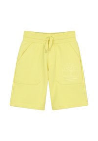 Pantaloni corti gialli in cotone con vita elastica, coulisse, due tasche laterali e un logo in rilievo con un design di un albero sul davanti.