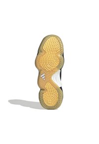 Suela de zapatilla deportiva negra con patrones en espiral, goma amarilla texturizada, acento blanco y logotipo de tres franjas blancas en el costado.