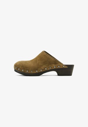 Brown suede clogs with a rounded toe, open back, and wooden heel, featuring silver stud accents along the side.