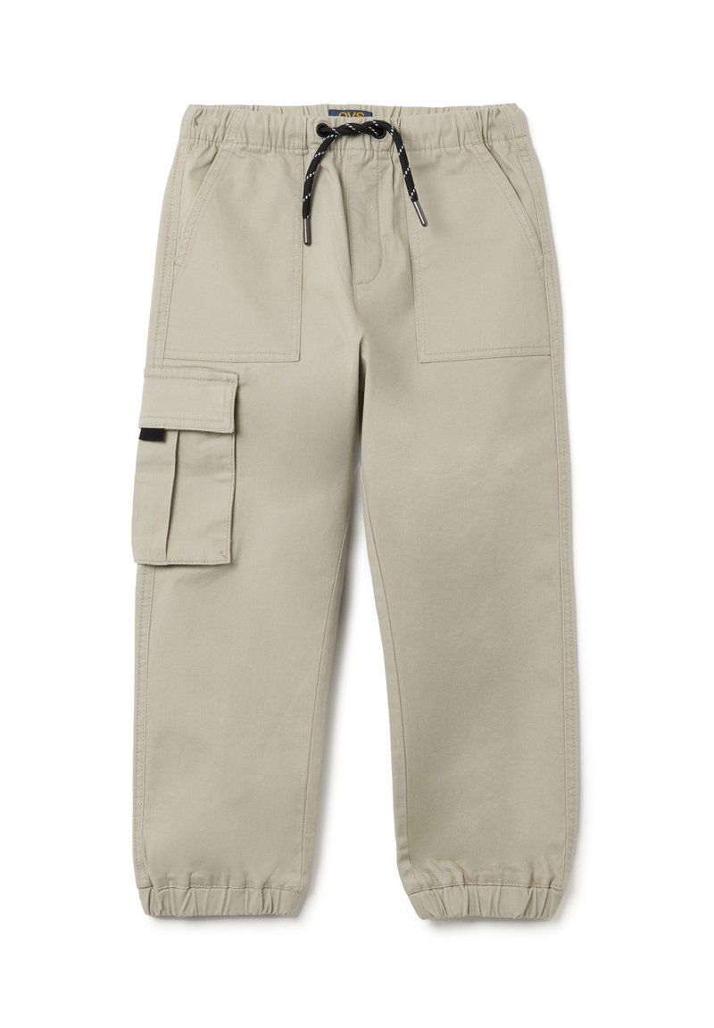 Beige cargobroek met een elastische tailleband, trekkoordsluiting en tapse boorden. Kenmerkt zich door meerdere zakken en een gladde textuur.